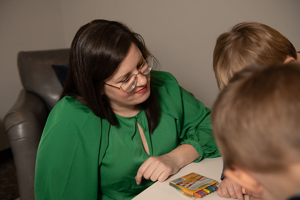 Child therapist working with patients to provide counseling services in Sycamore IL, at Wellspring Center for Counseling.