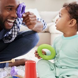 Becoming Playful Parents - Dad playing with his baby